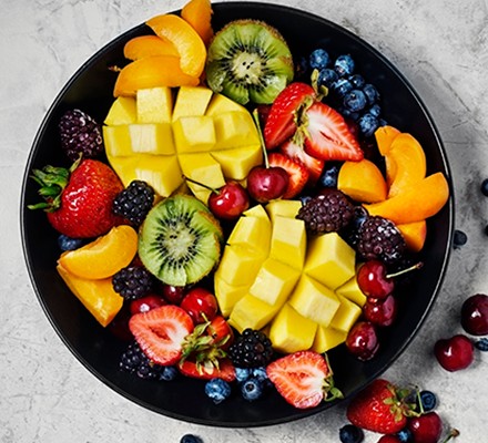 Top 20 healthiest fruits Fresh fruit in a black bowl