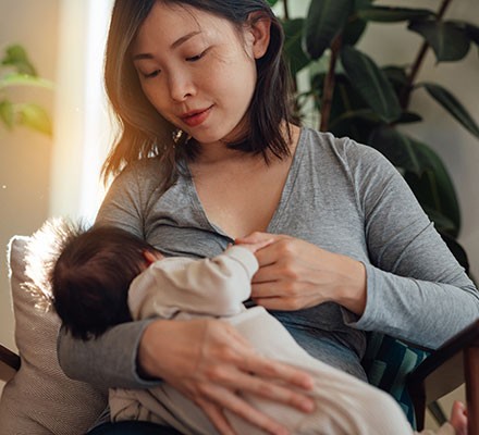 A woman breastfeeding a baby