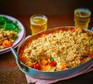 Butternut squash & cherry tomato crumble Butternut squash & cherry tomato crumble in a baking dish