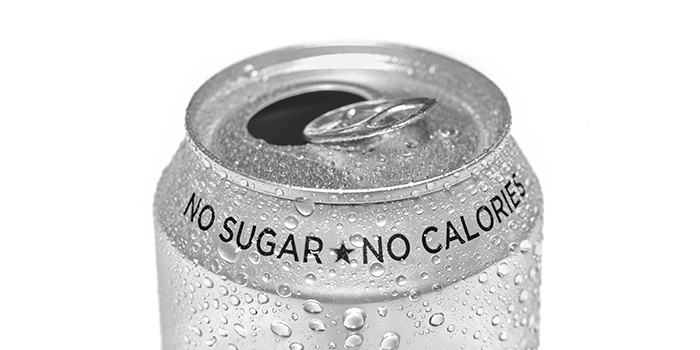 Top of an open can of drink. Text at the top of the can reads 'No sugar, no calories'