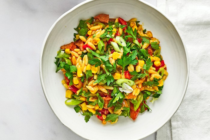 Chorizo, orzo & sweetcorn summer stew in two bowls
