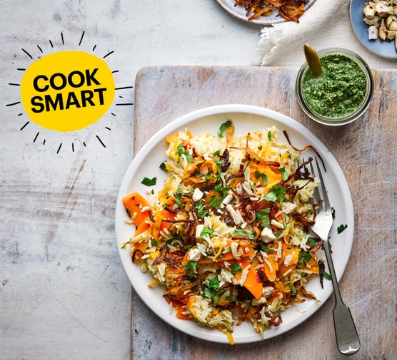 Carrot pilaf with homemade coriander chutney served in a white bowl