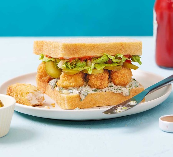 A fish finger sandwich on a plate