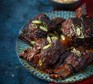 Slow-cooker gochujang short ribs with apple slaw served on a plate