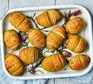 Top 5 health benefits of potatoes Hasselback potatoes in a baking dish with rosemary