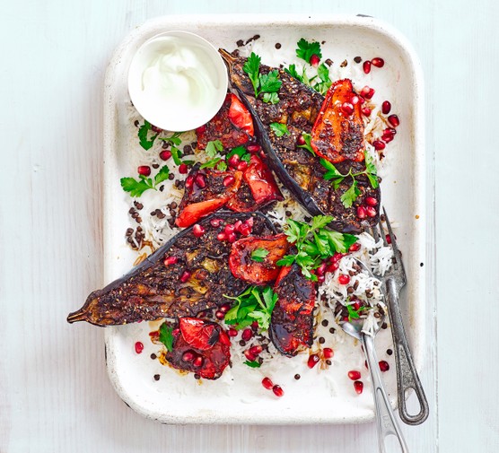 Healthy gluten-free spring recipes Spice-crusted aubergines and peppers on a tray with rice pilaf and yogurt