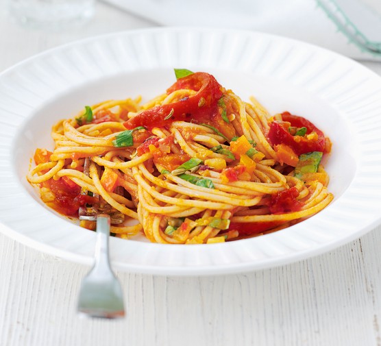 Tomato spaghetti with veg in a bowl
