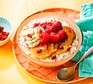 Bowl of porridge topped with fresh fruit