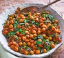Chickpea curry Chickpea curry in a round dish with spoon
