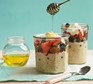Overnight oats served with berries and honey