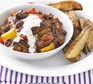 Mixed-bean chilli with wedges Vegetarian mixed-bean chilli served with wedges