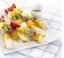 Frozen fruit sticks with passion fruit & lime drizzle