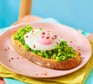 Smashed peas on toast with an egg on top
