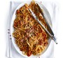 Super smoky bacon & tomato spaghetti Super smoky bacon & tomato spaghetti with tongs for serving