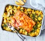 Spiced salmon with traybaked sag aloo in a serving dish