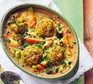 Spring veg stew with cheddar dumplings in a casserole dish