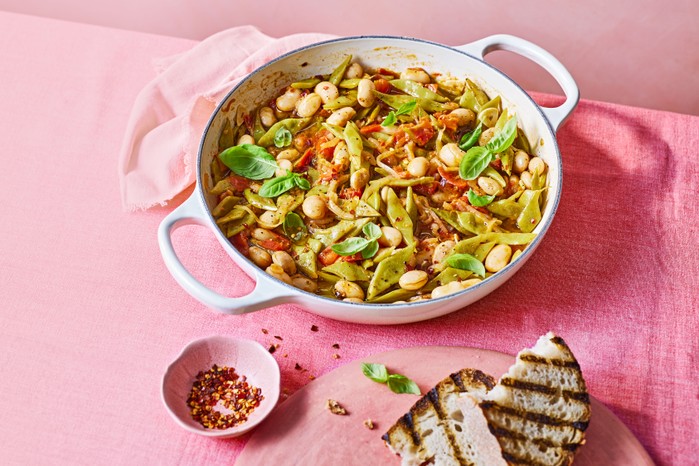 Round oven dish of runner bean stew