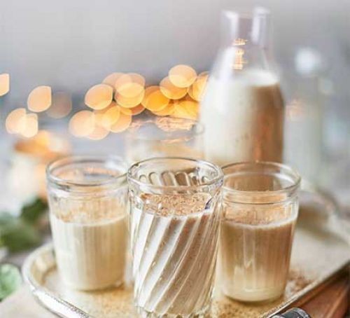 dairy-free Christmas eggnog in glass jug and glasses