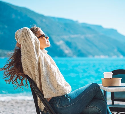 A woman sat in sunshine