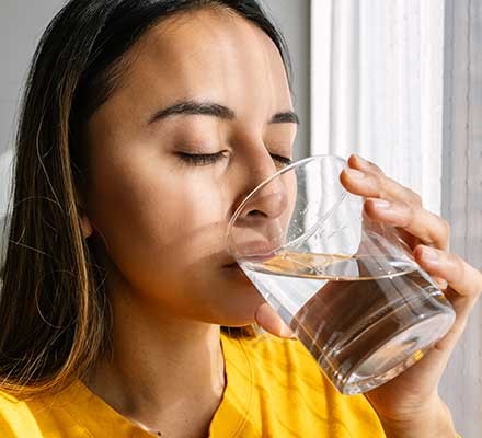 Woman drinking a glass of water