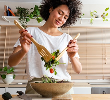 Woman making healthy salad